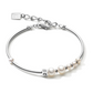Silver bracelet with pearls and a clear stone on a white background