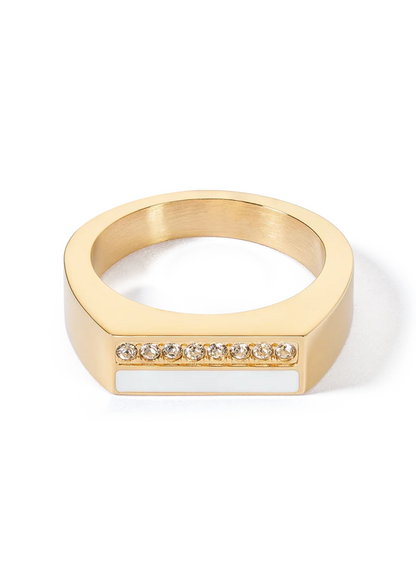Gold ring with embedded crystals on a white background