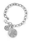 Front view of a silver chain bracelet with a lobster claw clasp and two swirled medallion charms.
