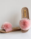 Pair of pink pom-pom sandals with woven footbed 