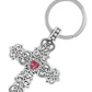 Front view of a silver cross key chain with a red heart in the middle