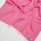 Pink fabric with a brand label on a white background