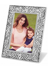 Swirled floral inspired silver picture frame for both portrait and landscape orientation photos.