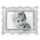 Front view of a silver plated photo frame with an intricate cut out design. 