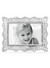 Front view of a silver plated photo frame with an intricate cut out design. 