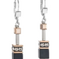 Front view of two onyx, rose gold and silver earrings.
