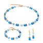 View of the turquoise GeoCUBE collection featuring a necklace, bracelet and earrings