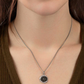 Necklace with a pendant worn by a person