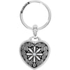 Silver keychain with a heart-shaped black and white floral design on a white background