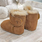 Back view of a pair of chestnut coloured booties with a cosy lining
