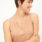 Model wearing this silver bracelet with a matching necklace and earrings.