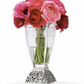 View of a clear glass vase with a silver base