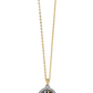 Close up view of a silver and gold woven pendant necklace with a gold chain