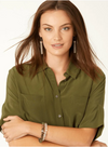 Model wearing a green shirt and modelling  two crystal stretch bracelets