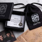 Pyrrha jewelry set with necklace, box, and packaging on a marble surface