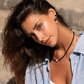 Model wearing the coeur de Lion pearl and onyx earrings and matching necklace.