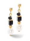 Front view of a pair of gold, onyx and pearl dangle earrings