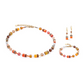 View of the GeoCUBE sunset gold collection featuring a necklace, earrings and a bracelet.