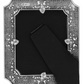 Beautifully designed silver photo frame with intricate swirled details.