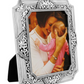 Beautifully designed silver photo frame with intricate swirled details.