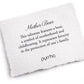 White pillow with text about 'Mother Bear' talisman and brand name 'pyrrha'
